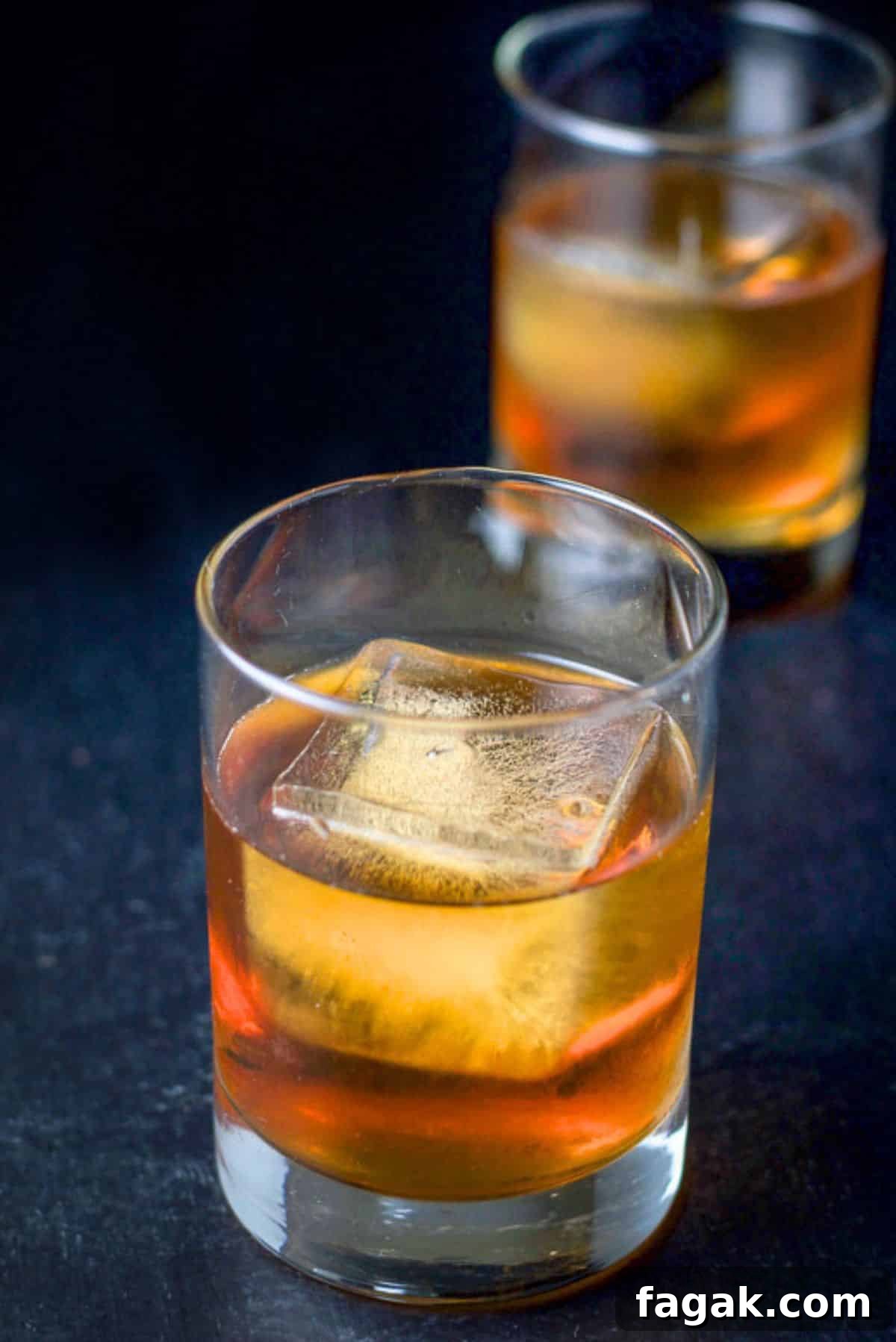 How to Make a Classic Godfather Cocktail: Recipe & Tips 5 Close-up of two double old-fashioned glasses filled with the scotch drink