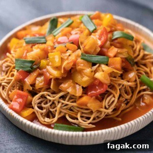 sweet and sour vegetables over crispy noodles
