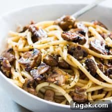 mushroom spaghetti garnished with parmesan