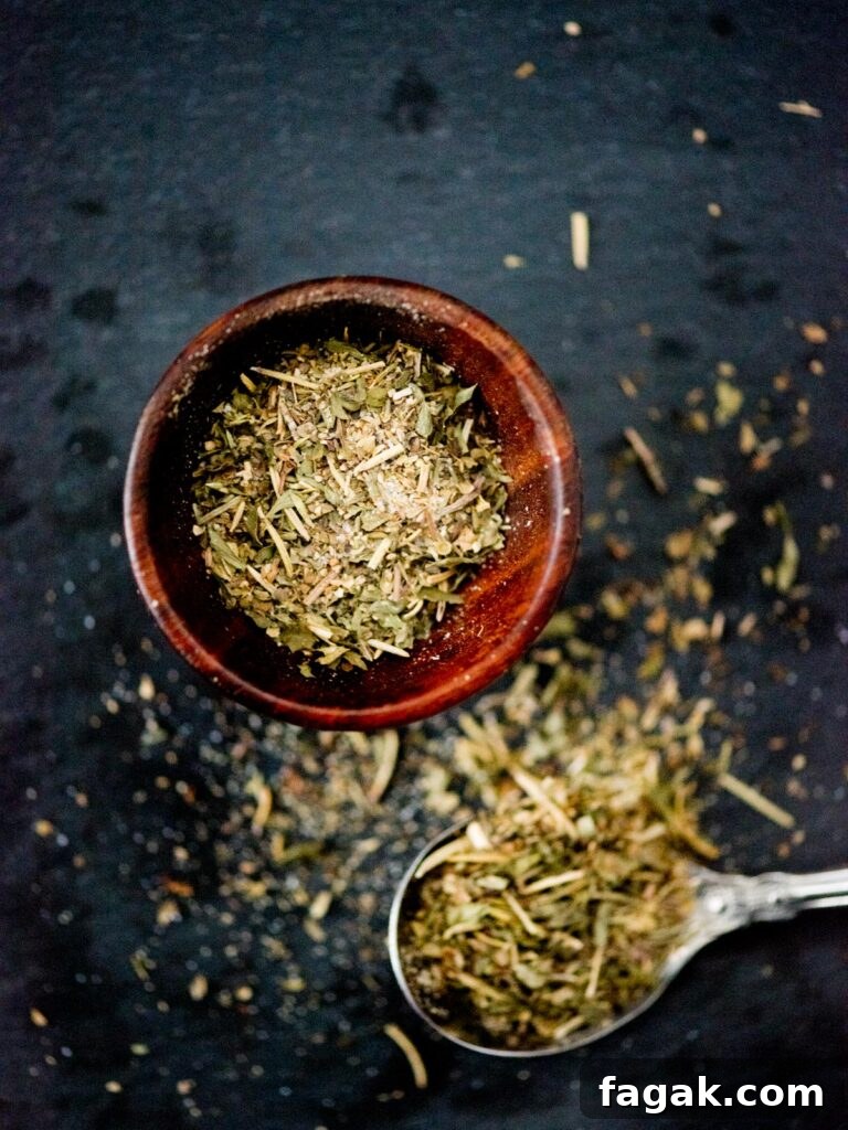 Authentic Greek Seasoning Blend from Everyday Spices 2 greek seasoning in a small pinch bowl and on a spoon
