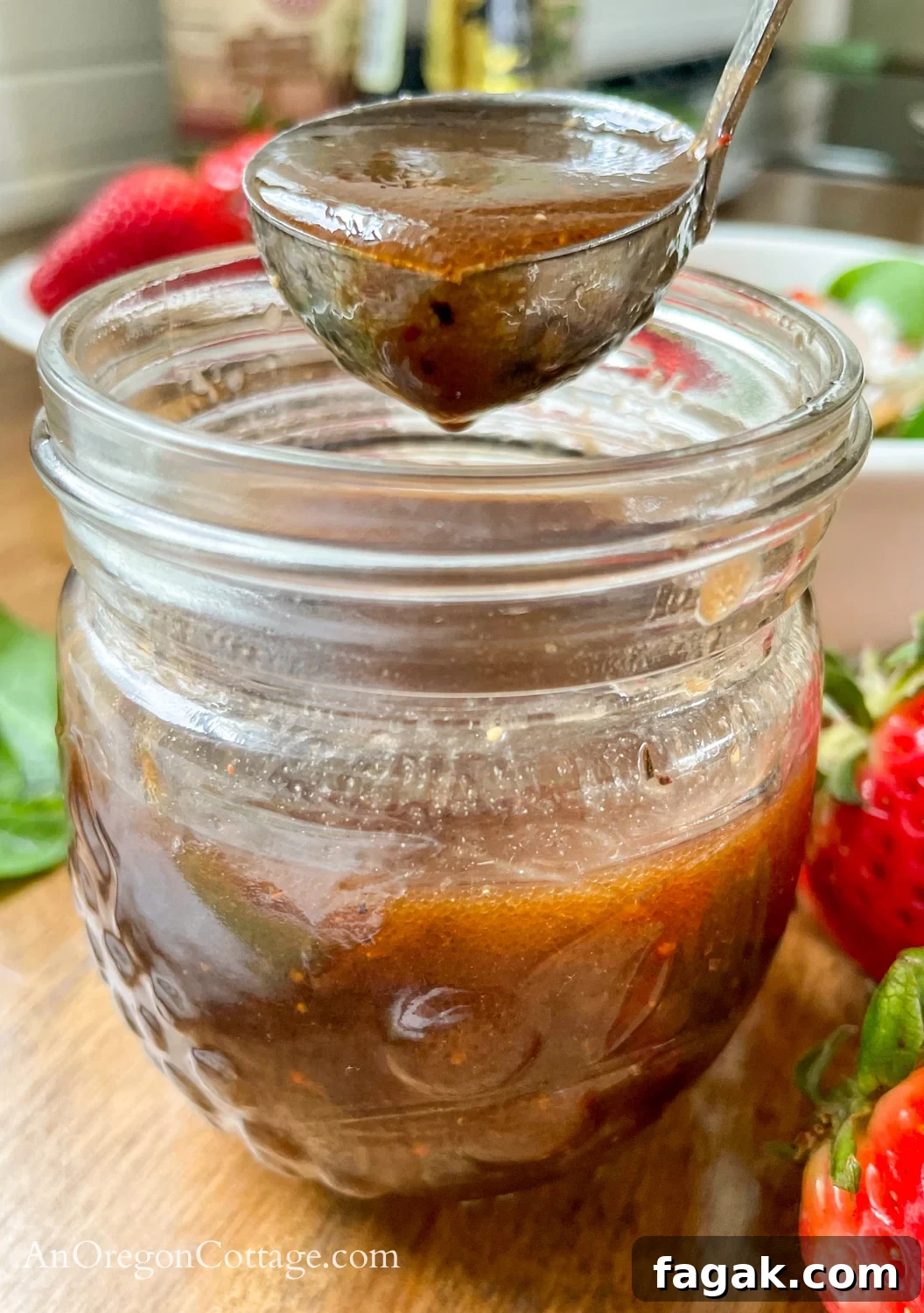 Strawberry Vinaigrette salad dressing on spoon