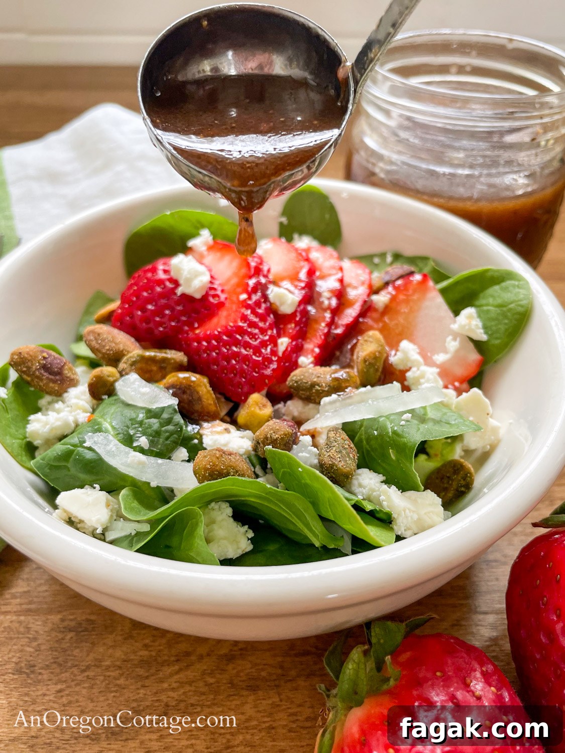 pouring vinaigrette on salad