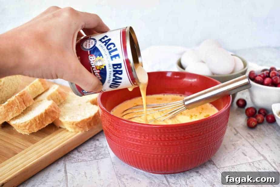 making the custard with condensed milk for cranberry almond baked french toast
