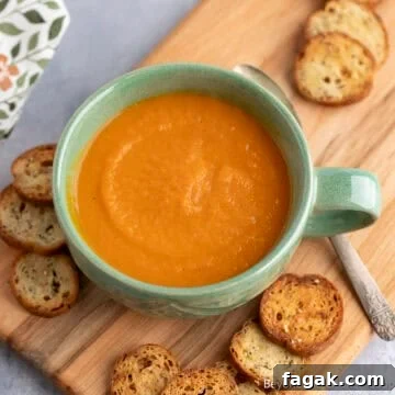Carrot Ginger Soup in a green mug.