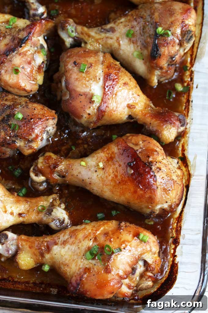 Baked Chicken Drumsticks on a baking pan.