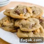 Scotcheroo Cookies are a delightful twist on the classic cookie recipe. These cookies are the perfect combination of sweet, chewy, and indulgent, with a touch of butterscotch, peanut butter, and milk chocolate chips.
