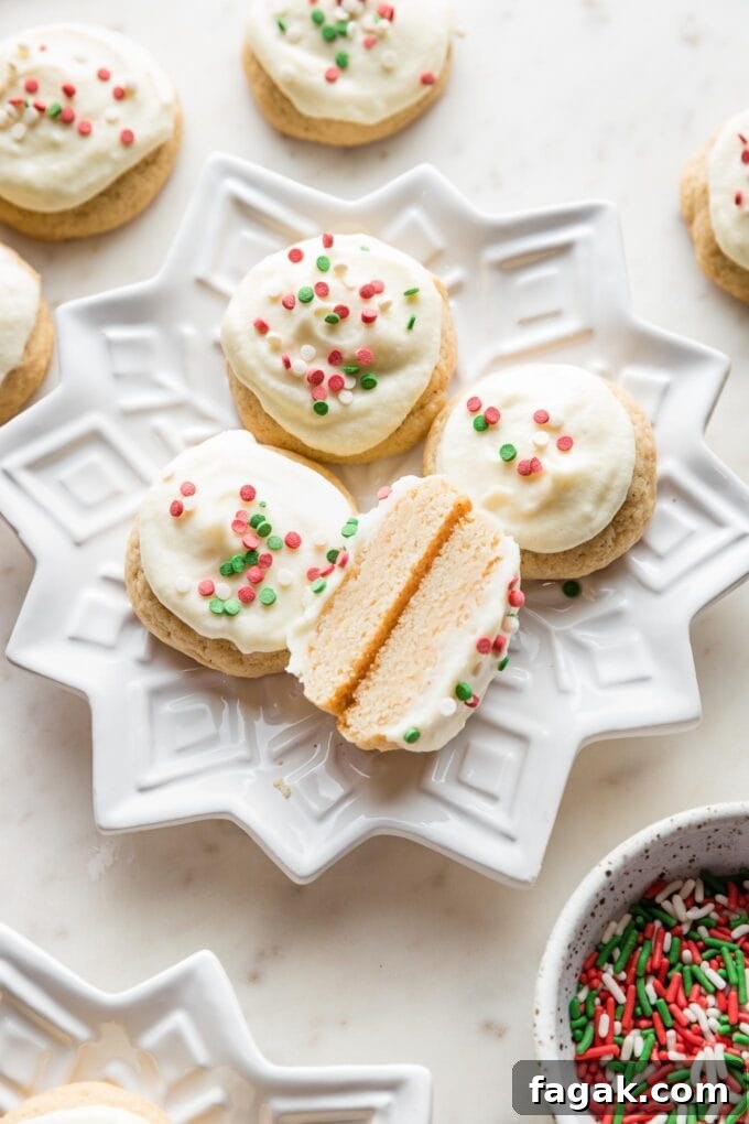 Close-up of an eggnog sugar cookie cut in half to show the soft, tender interior.