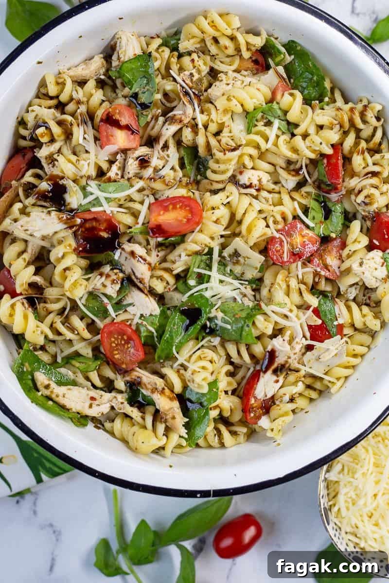 Chicken pesto pasta salad in a bowl.