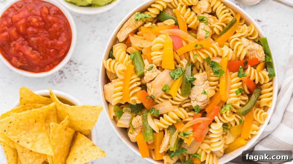 Chicken fajita pasta salad in a glass bowl.