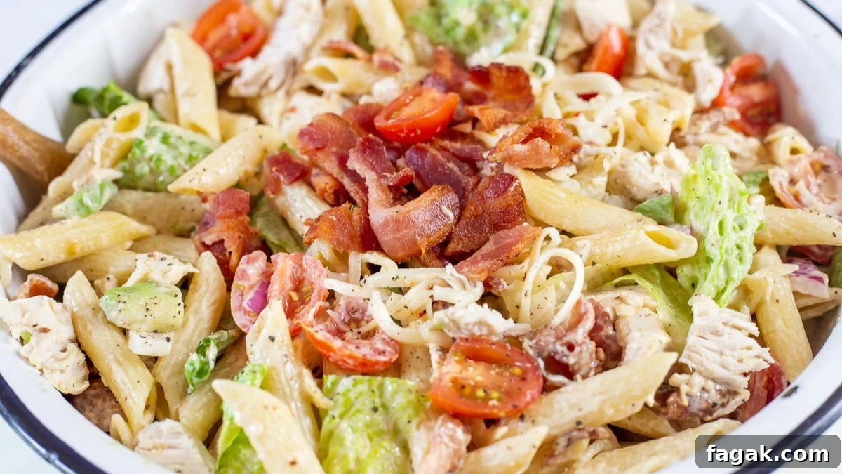 Chicken bacon ranch pasta salad in a white bowl.