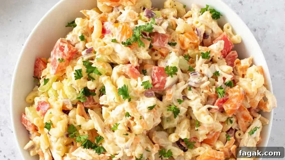 Chicken macaroni salad in a white bowl.