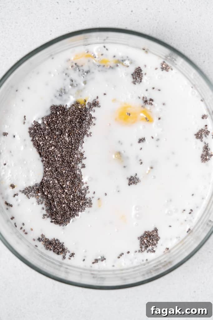 Creamy Mango Chia Pudding Recipe for Tropical Breakfast 9 coconut milk added over the chia and mango mix