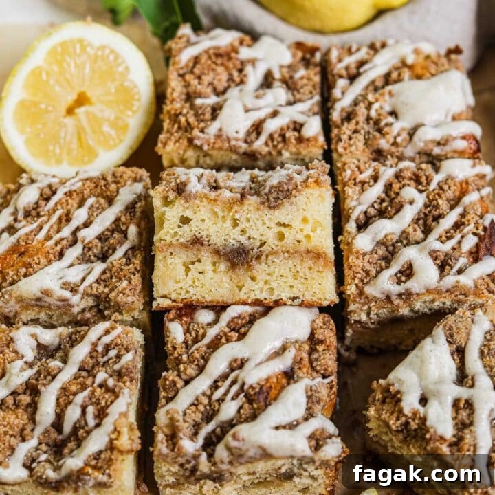 Sliced lemon curd coffee cake squares with streusel and glaze.