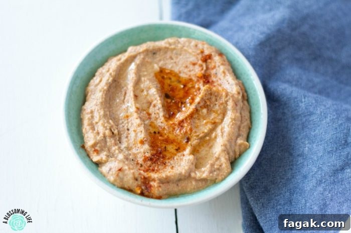 Spoon scooping taco hummus