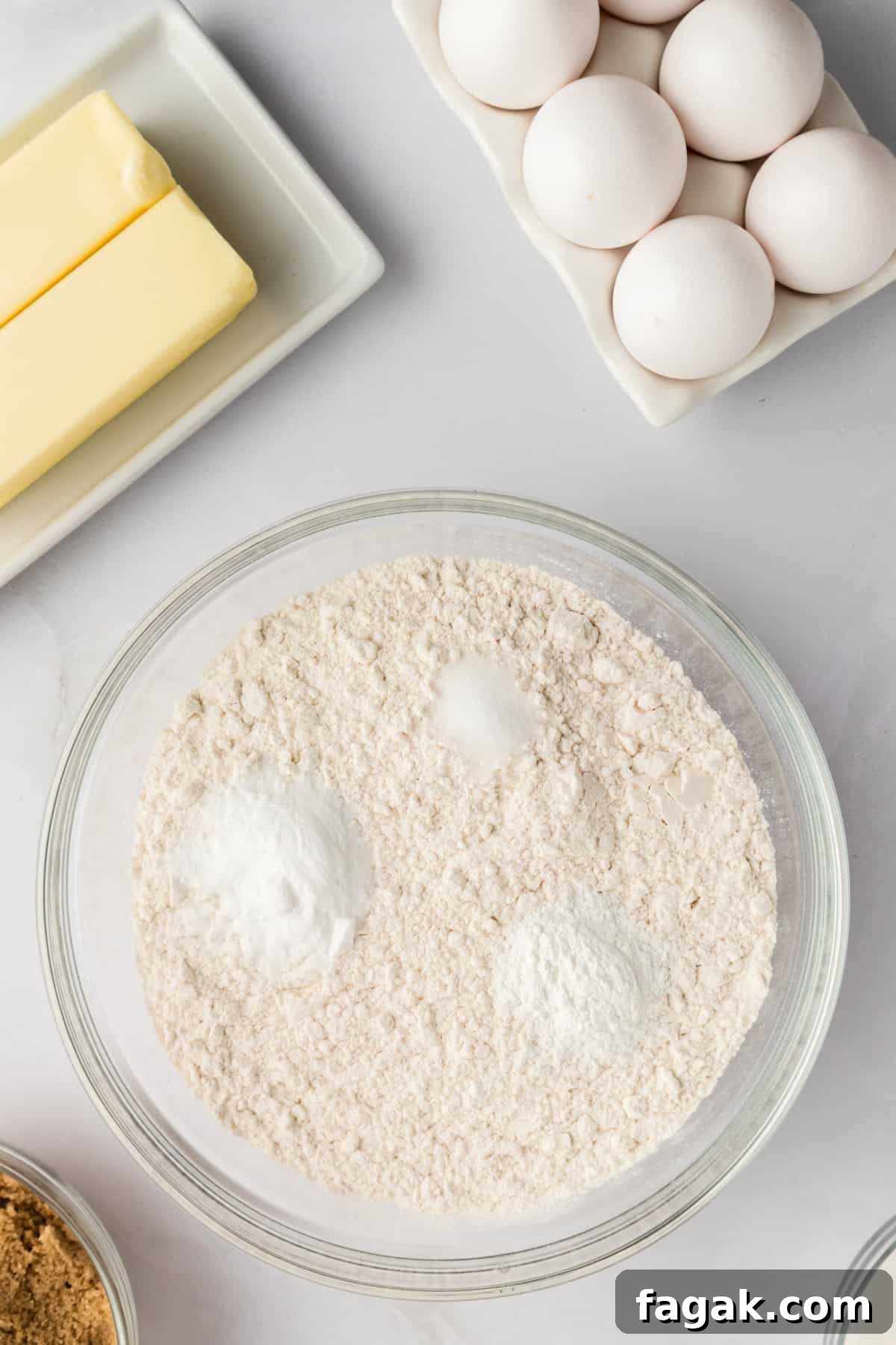 Dry ingredients in a glass mixing bowl.