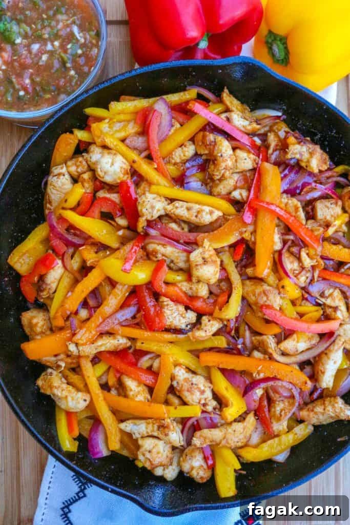 Skillet chicken fajitas in a cast-iron skillet