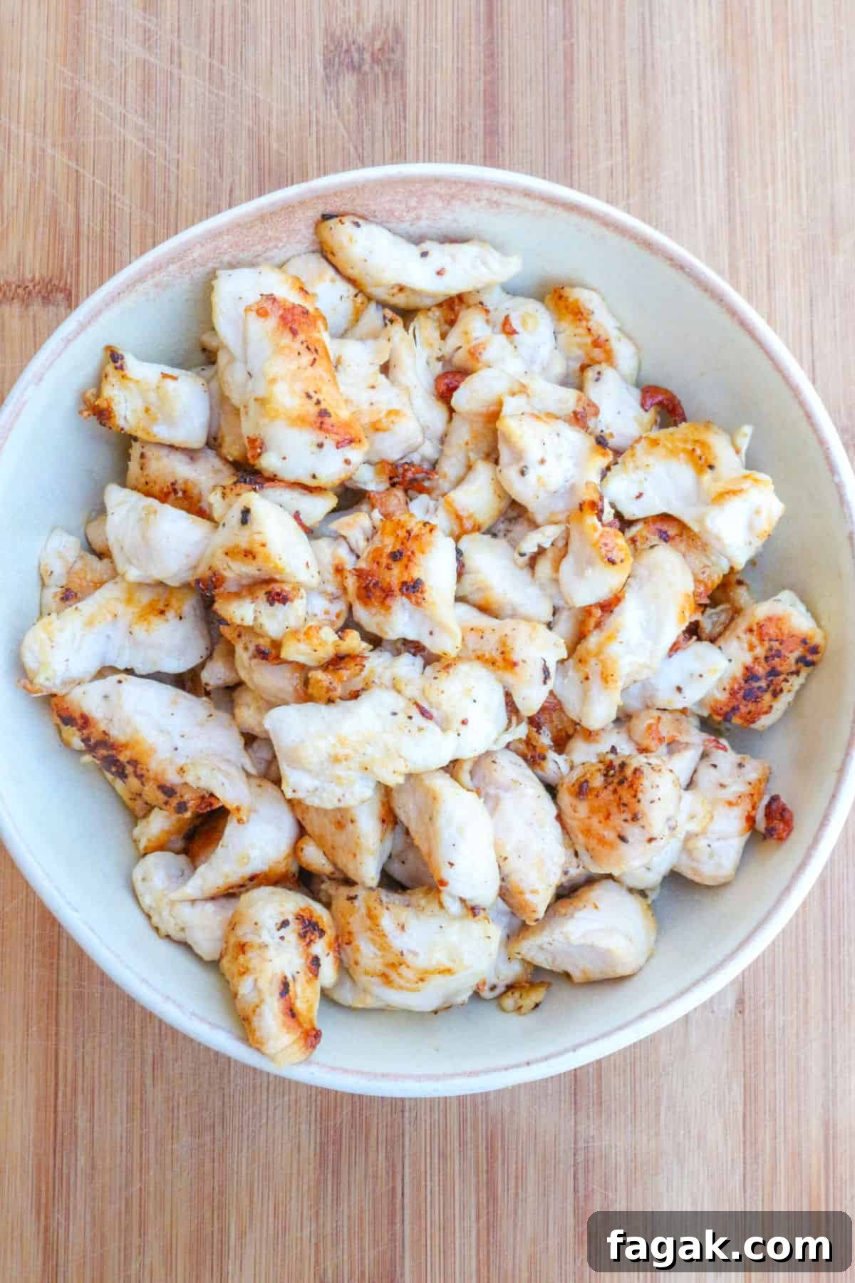 cooked chicken pieces in a bowl