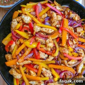 Skillet chicken fajitas in a cast-iron skillet