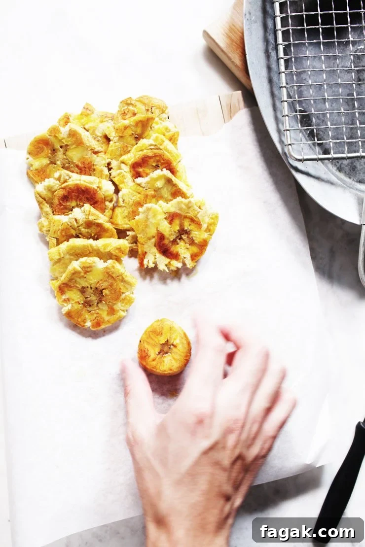 Smashing Plantains For Tostones