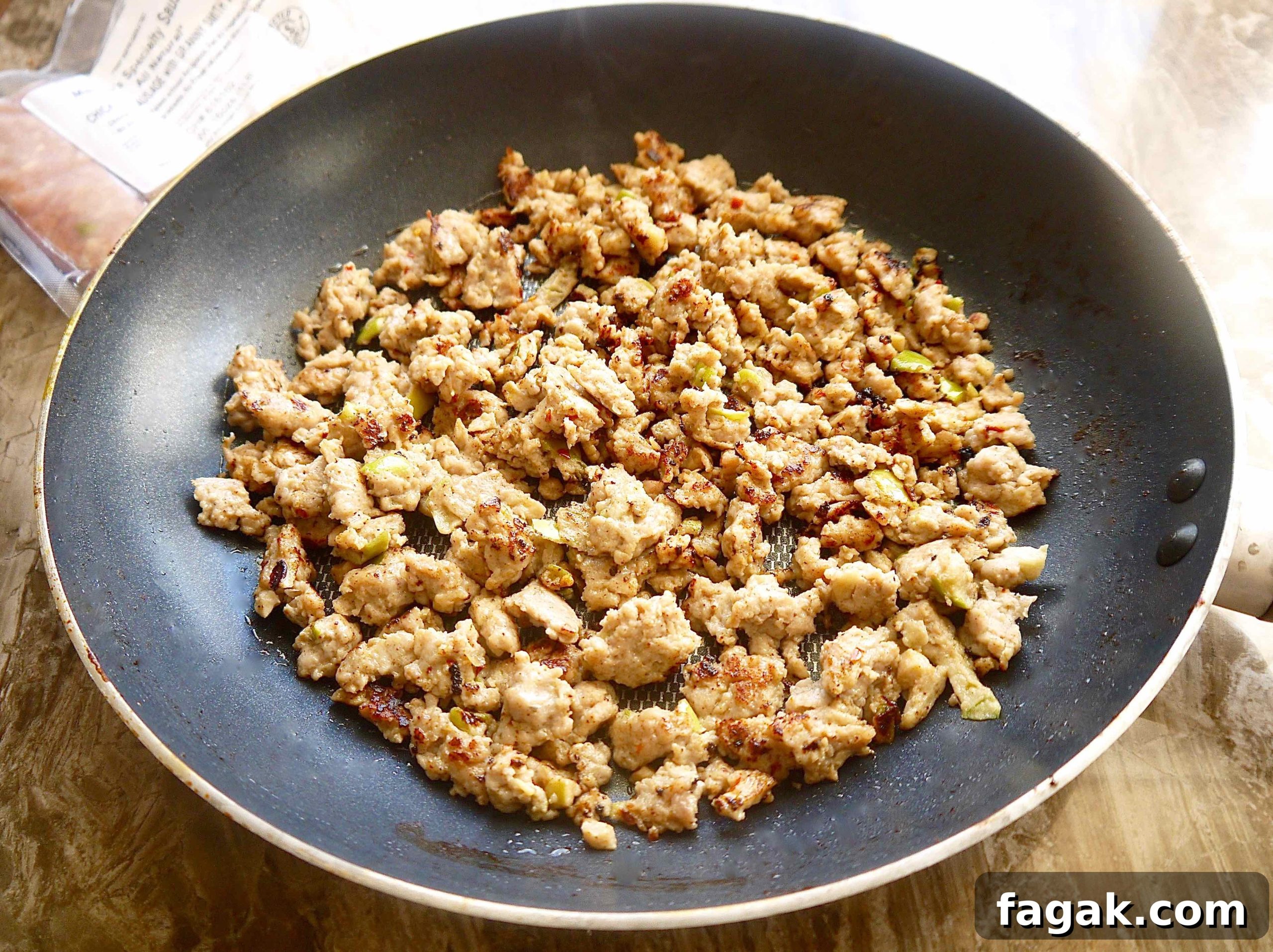 Cooked sausage in a pan.