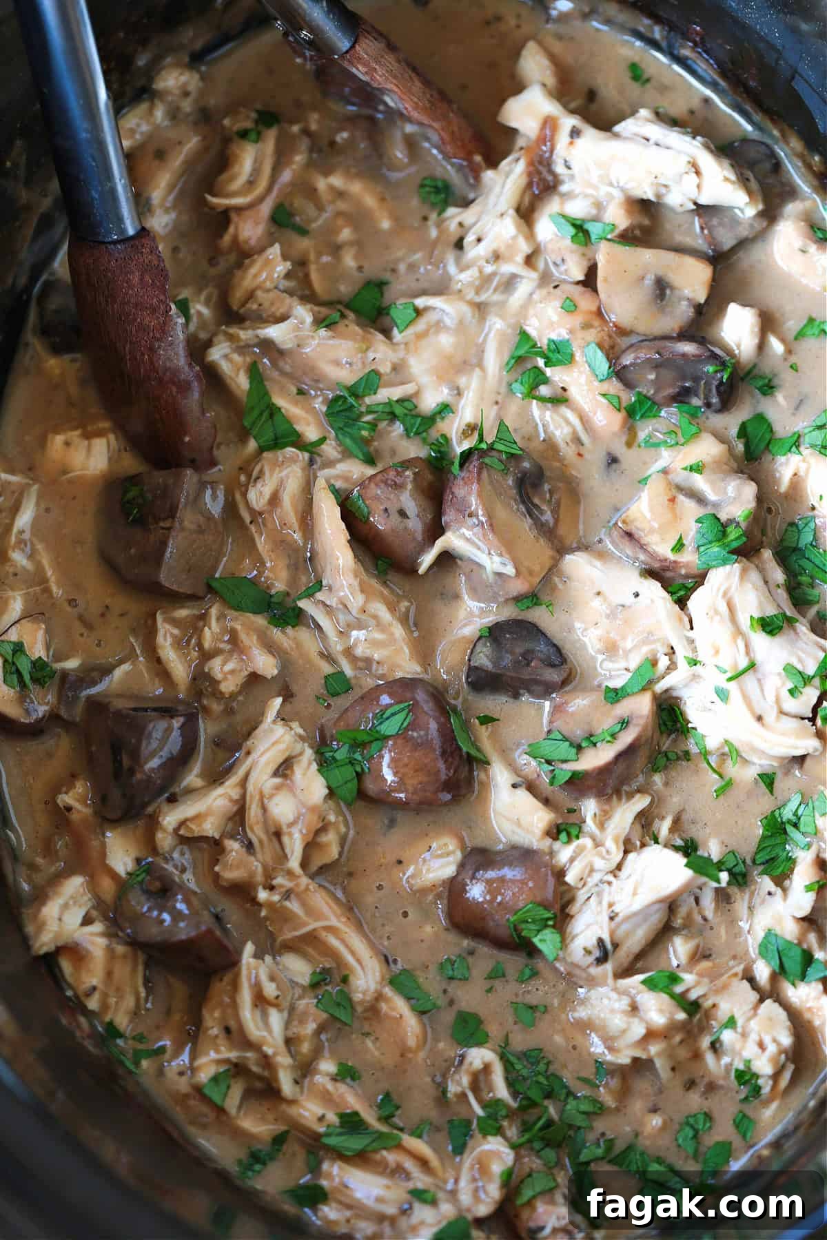 crock pot chicken stroganoff with tongs