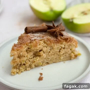 a single slice of apple buttermilk cake on a plate.