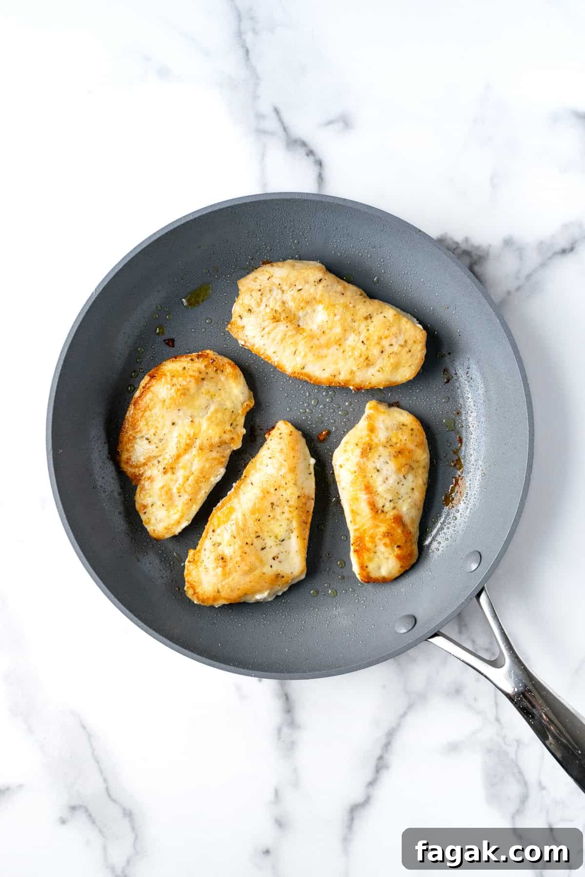 Creamy Chicken Florentine with Spinach and Parmesan 4 Cooked Chicken Cutlets in a Skillet.