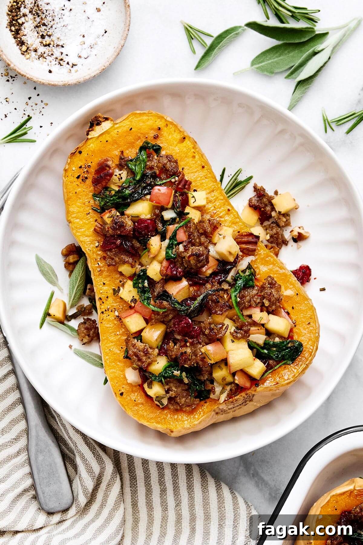 Apple sausage stuffed butternut squash with cranberries.