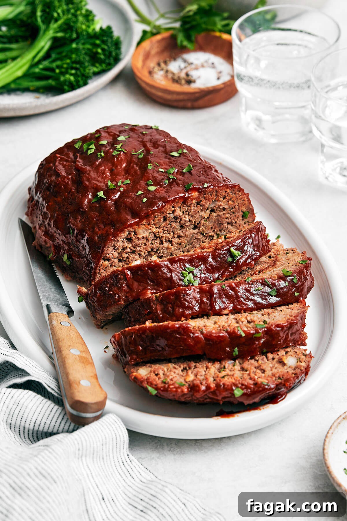 Sliced meatloaf on a platter.