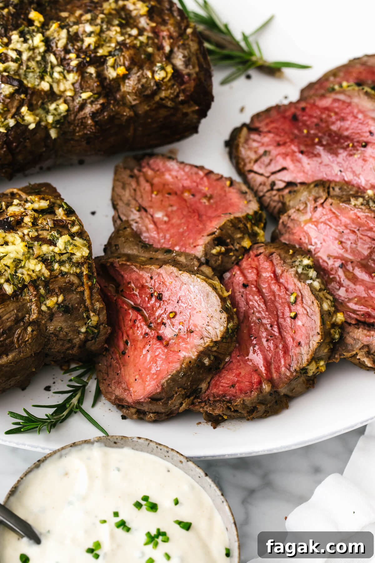 Slices of beef tenderloin roast on a plate