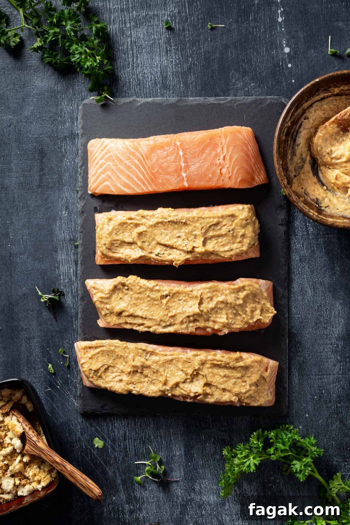 Salmon portions with parmesan and mayo mixture topping.