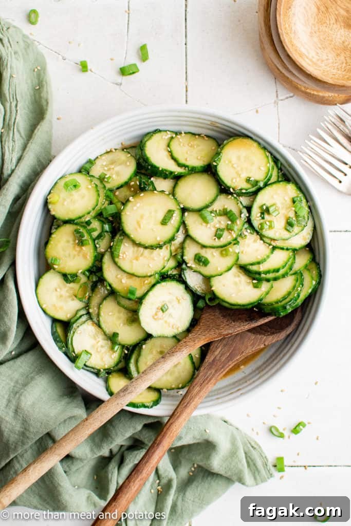 Top down view of cucumbers with dressing.