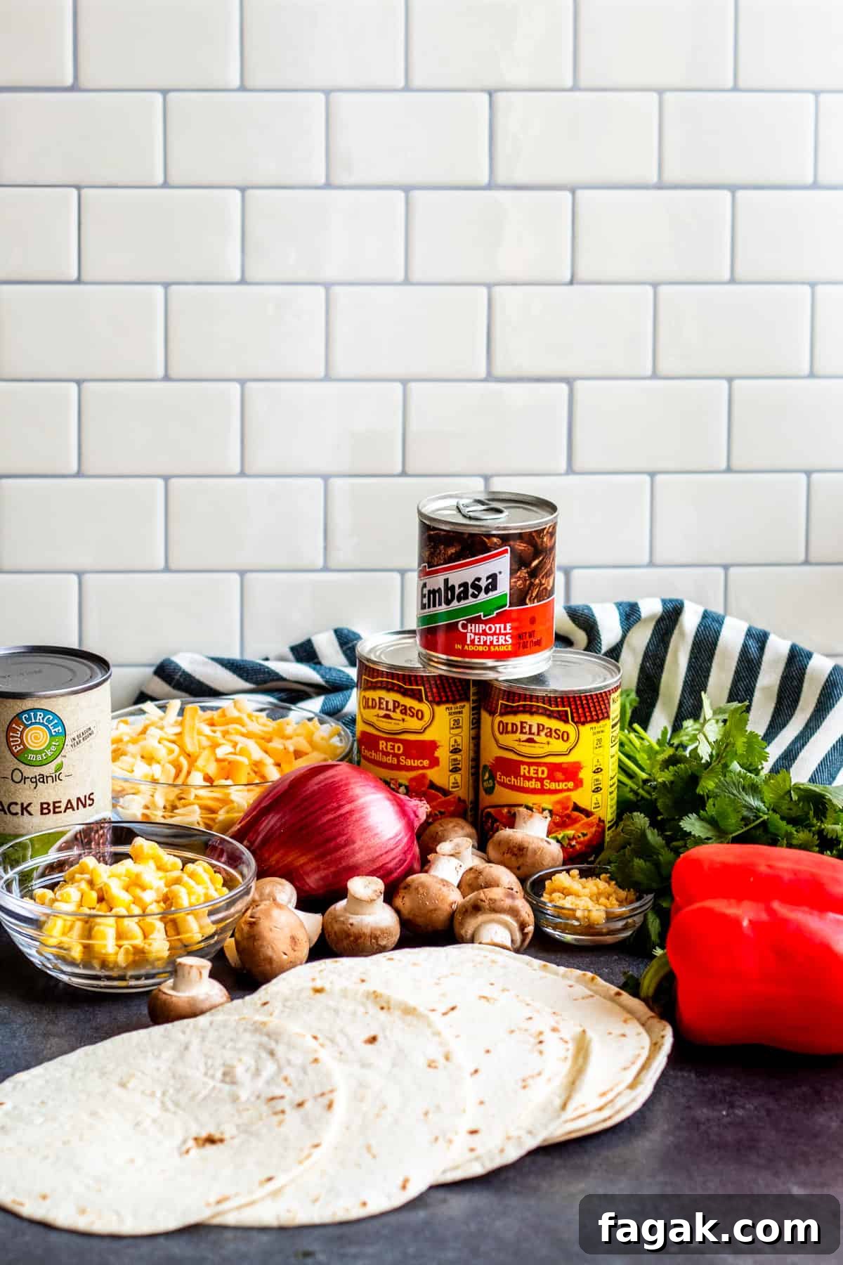 Mexican lasagna ingredients laid out on table.