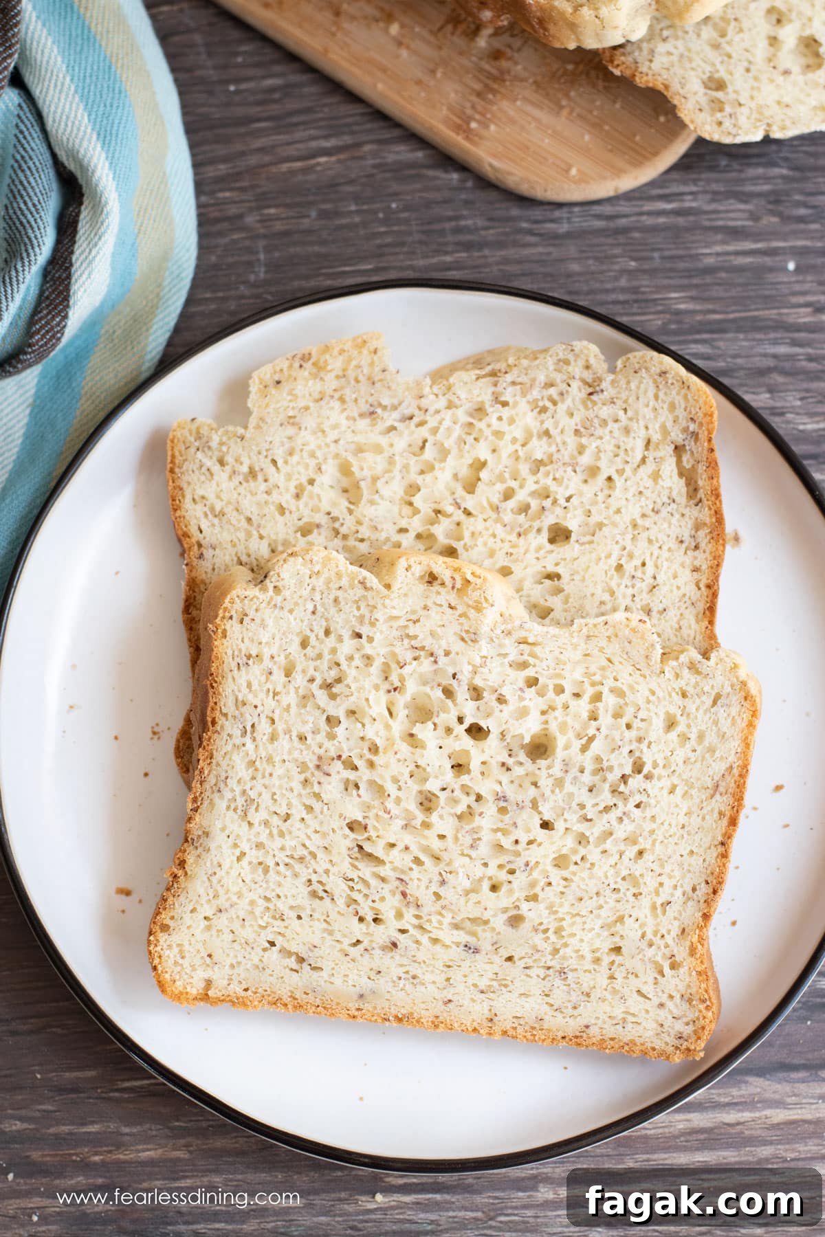 Two slices of gluten free bread machine bread on a plate.