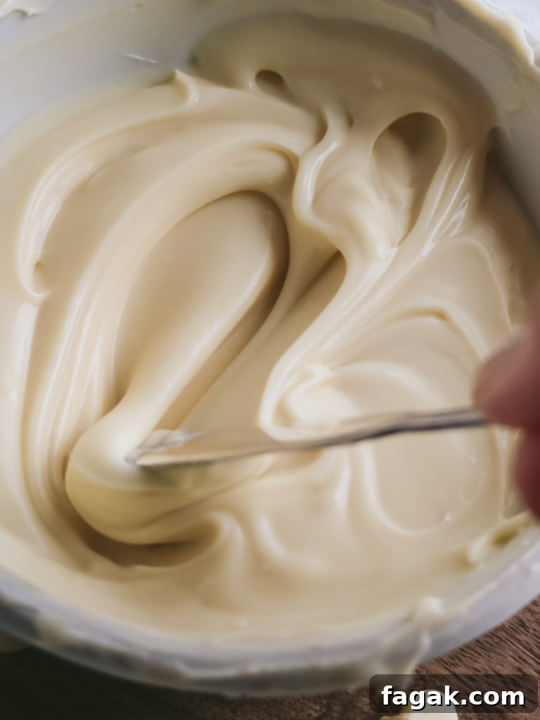 close up view of thick white chocolate ganache from the fridge.