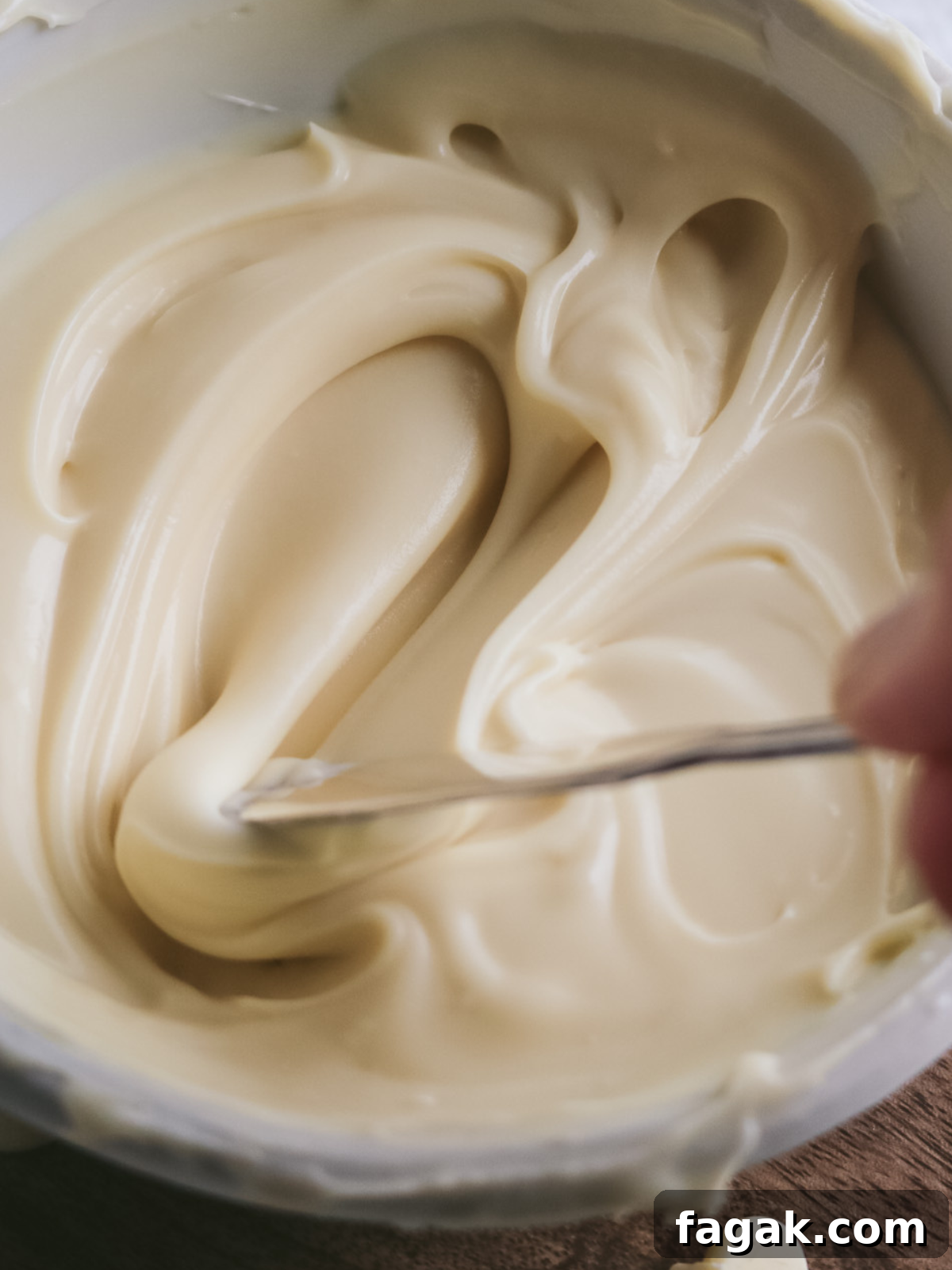 close up view of thick white chocolate ganache from the fridge.