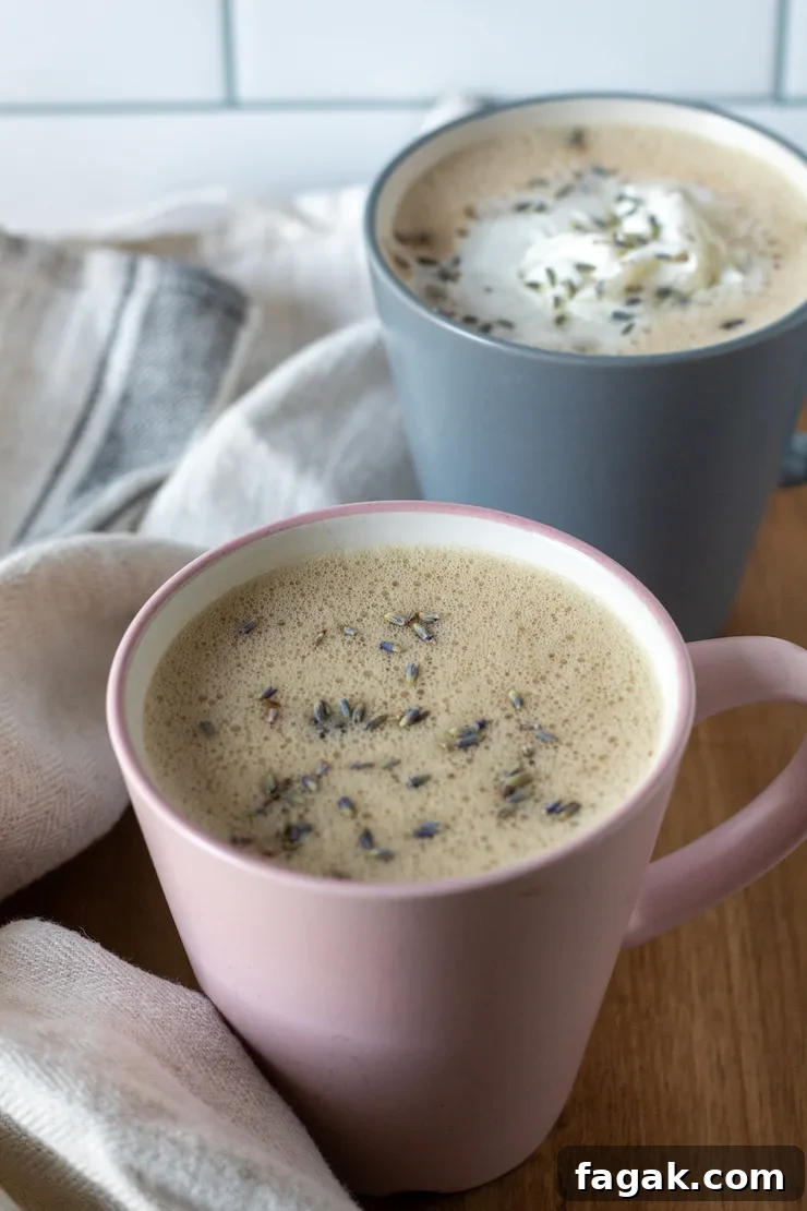 Honey lavender lattes, garnished with lavender buds and whipped cream.