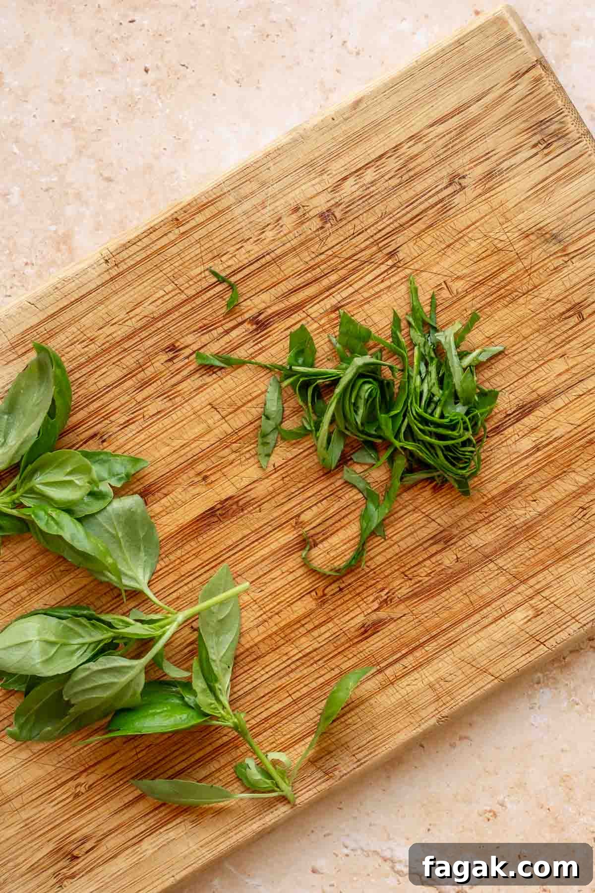 Basil chopped on a cutting board.