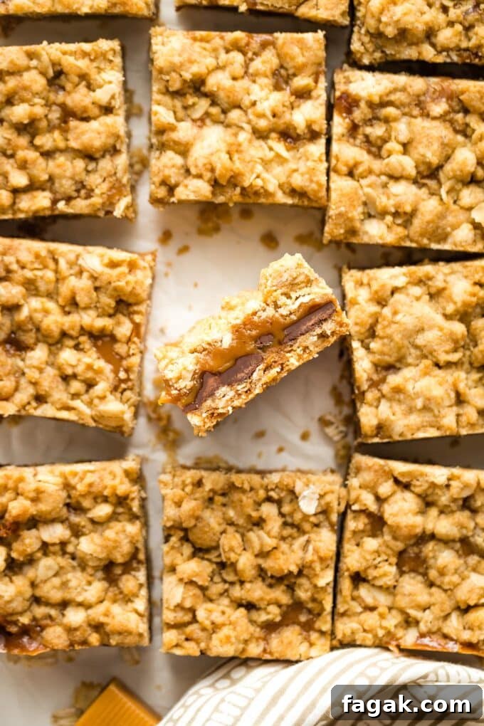 Close up of a carmelita bar showing layers of gooey caramel and chocolate.