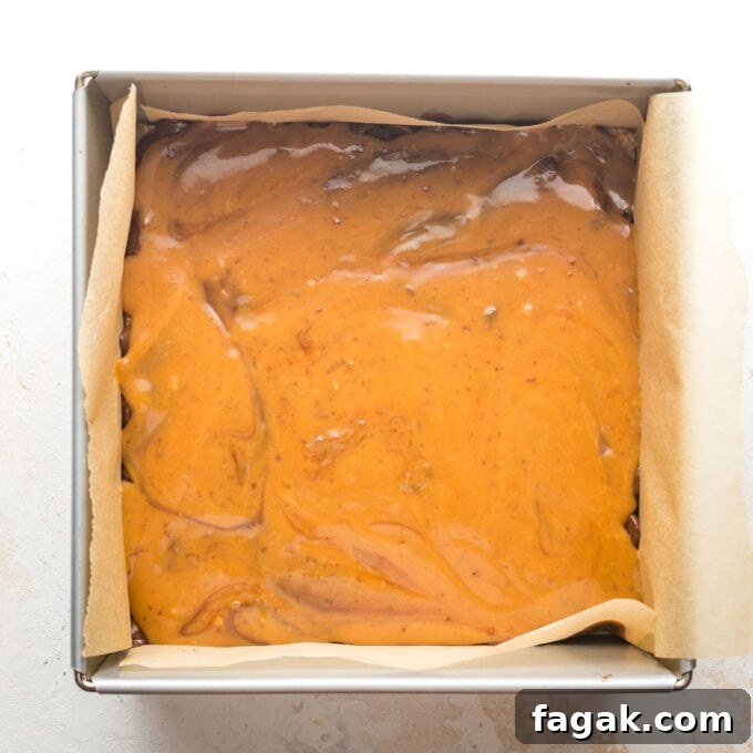 Caramel spread on top of chocolate chips.