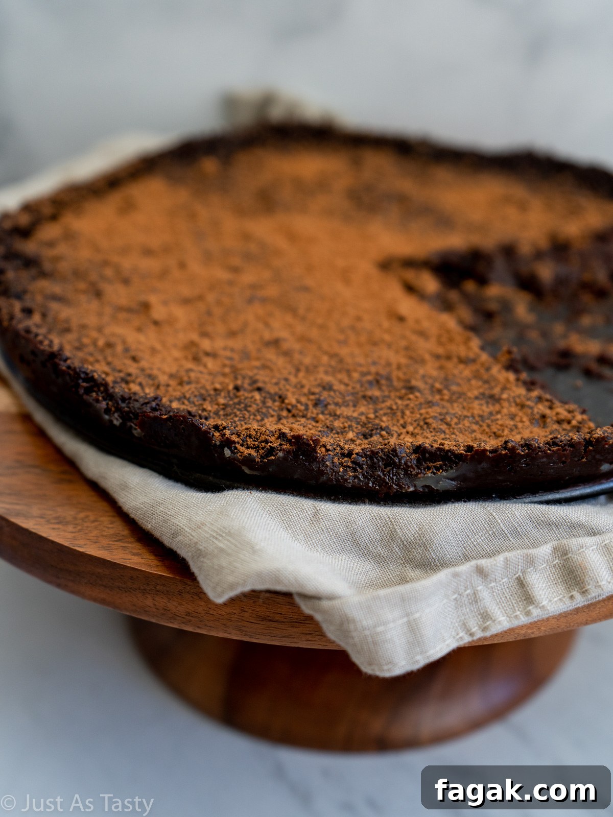 Close-up of flourless chocolate cake that has been cut into.
