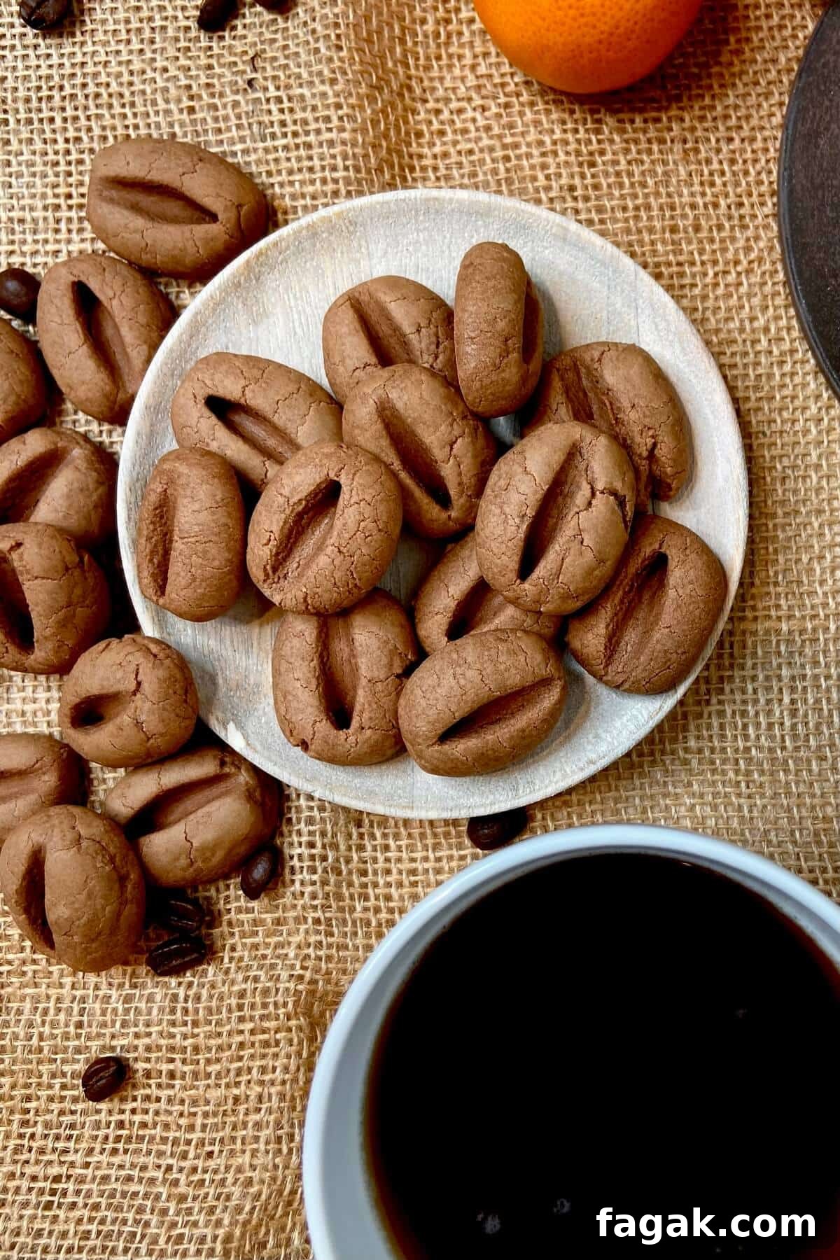 Cookies on a round wooden plate, on a burlap covered table.