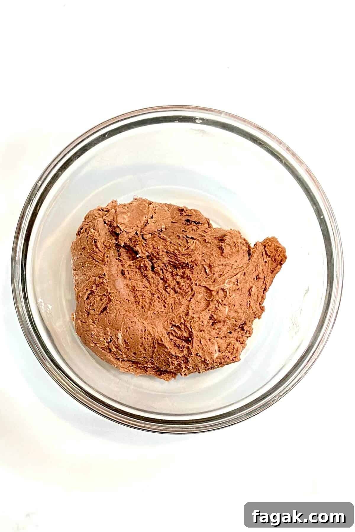 Batter mixed in a round glass bowl.