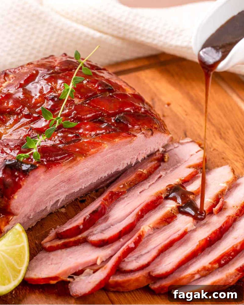 Slicing the glazed ham.