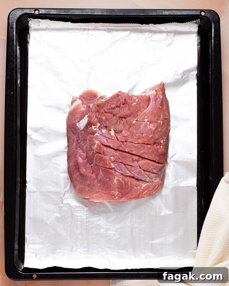 Roasting the ham in a pan.
