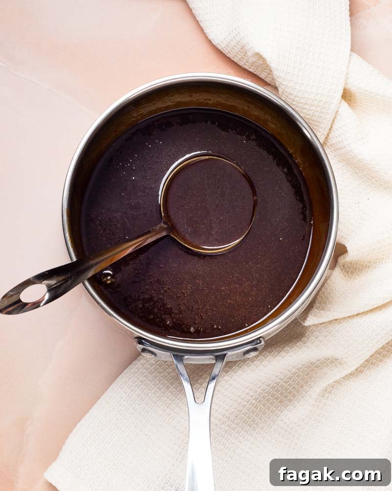 Glaze simmering in a saucepan.