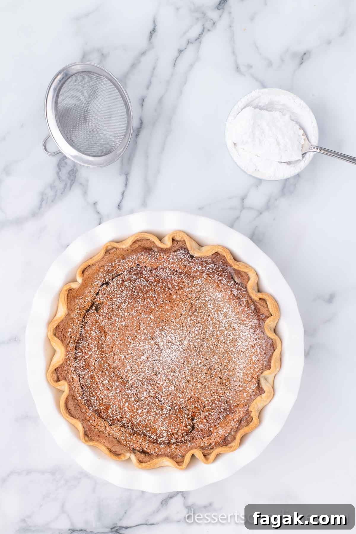 Pie baked and topped with powdered sugar.