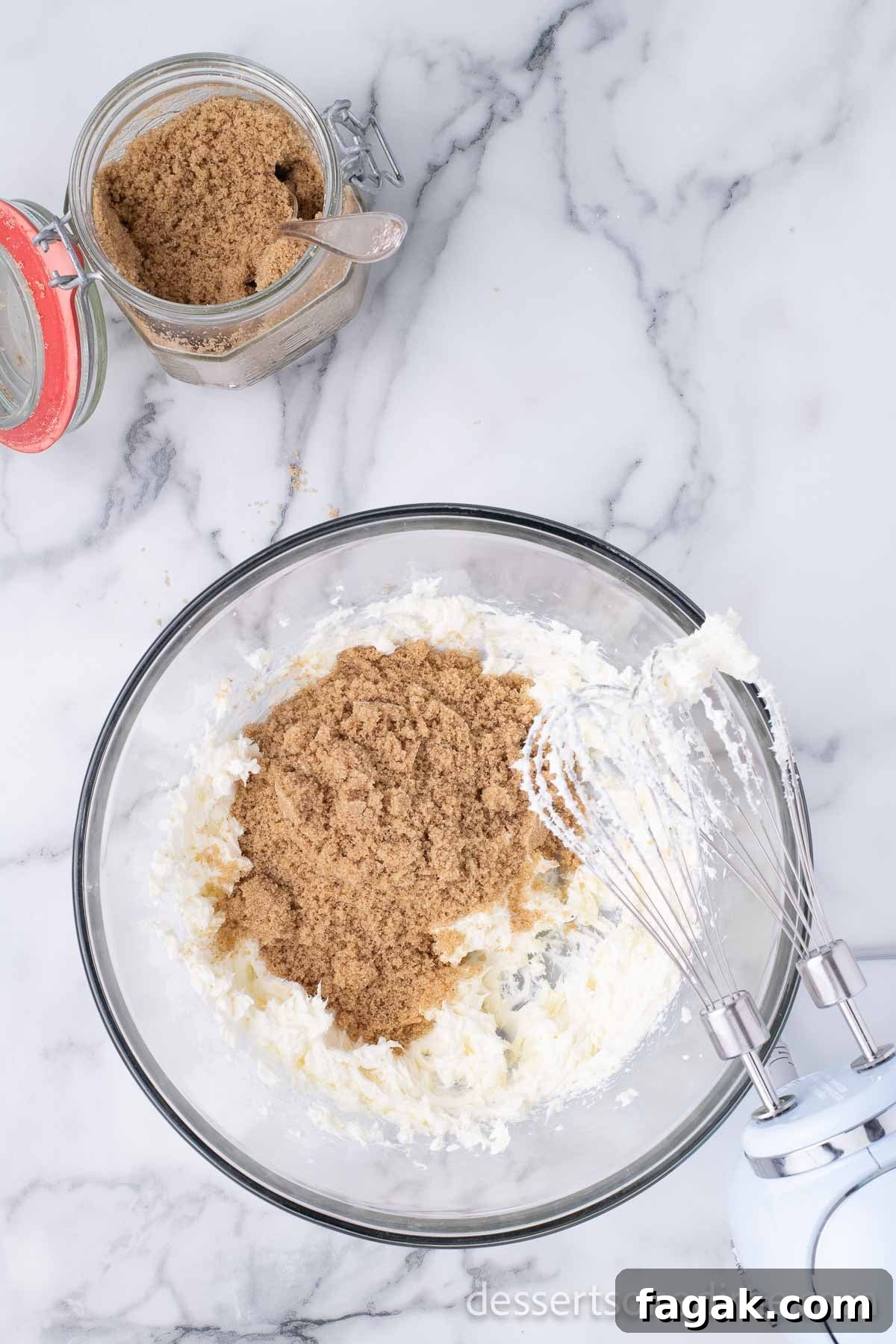 Mixing bowl with brown sugar and cream cheese.