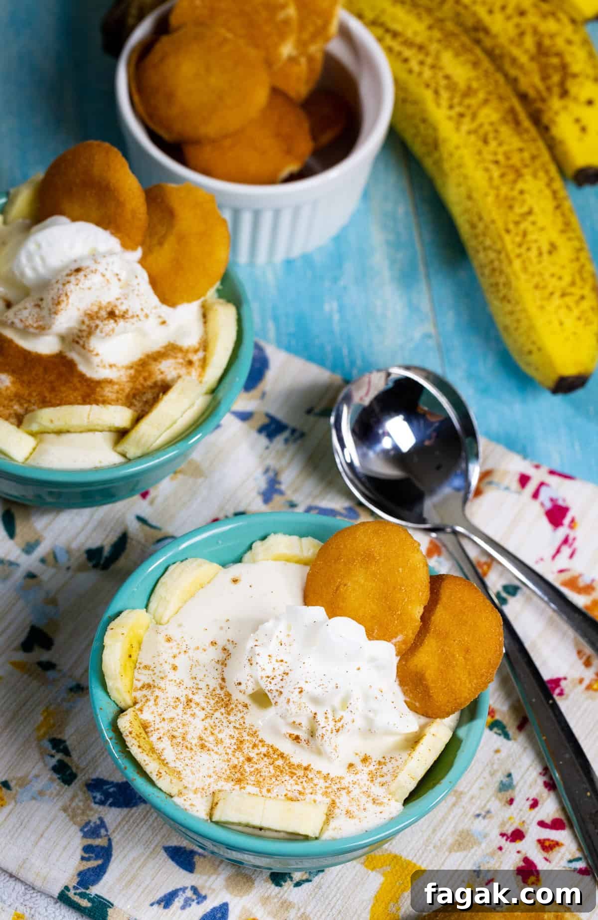 Two small bowls of Cottage Cheese Banana Pudding garnished with banana slices.