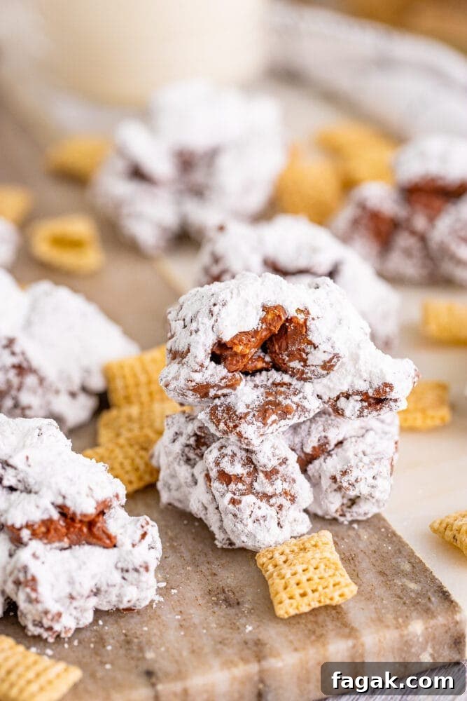 Delicious Chocolate Crinkle Muddy Buddy Cookies on a cutting board.